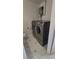 Contemporary laundry room with modern appliances and stylish geometric floor tiles at 3420 Ash St, Punta Gorda, FL 33950