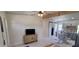 Bright living room with modern furnishings, a flat-screen TV, and an open-concept kitchen at 3420 Ash St, Punta Gorda, FL 33950