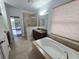 Relaxing bathroom with soaking tub, shower, and double vanity at 3263 Sea Grape Dr, Hernando Beach, FL 34607