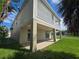 Two-story house with covered patio and fenced backyard at 3263 Sea Grape Dr, Hernando Beach, FL 34607