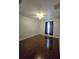 Bright bedroom with dark wood floors and ceiling fan at 3263 Sea Grape Dr, Hernando Beach, FL 34607
