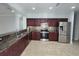 Kitchen with granite countertops and stainless steel appliances at 3263 Sea Grape Dr, Hernando Beach, FL 34607