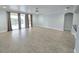 Bright living room with hardwood floors and balcony access at 3263 Sea Grape Dr, Hernando Beach, FL 34607