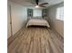 Bright bedroom with a king-size bed and hardwood floors at 1359 Cambridge Dr, Venice, FL 34293
