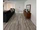 Living room with entryway view and mid-century modern furniture at 1359 Cambridge Dr, Venice, FL 34293