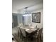Bright dining room with a large table and modern light fixture at 1359 Cambridge Dr, Venice, FL 34293