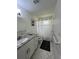 Clean bathroom with granite vanity, tub, and shower at 1359 Cambridge Dr, Venice, FL 34293