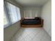 Small bedroom with a daybed and window coverings at 1359 Cambridge Dr, Venice, FL 34293