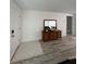 Entryway with wood-look flooring and mid-century modern console table at 1359 Cambridge Dr, Venice, FL 34293