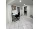 Home office with standing desk and view into bedroom at 1359 Cambridge Dr, Venice, FL 34293