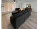 Living room with sectional sofa and wood-look flooring at 1359 Cambridge Dr, Venice, FL 34293