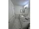 Modern bathroom with granite countertop and updated fixtures at 1359 Cambridge Dr, Venice, FL 34293