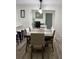 Spacious dining area with large table and view of home office at 1359 Cambridge Dr, Venice, FL 34293