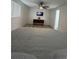 Spacious bedroom with large bed, ceiling fan, and hardwood floors at 1359 Cambridge Dr, Venice, FL 34293