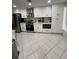 Modern kitchen with white cabinets and stainless steel appliances at 1359 Cambridge Dr, Venice, FL 34293
