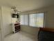 Bedroom with dresser, window coverings and ceiling fan at 1359 Cambridge Dr, Venice, FL 34293