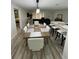 Open concept dining room adjacent to kitchen and living room at 1359 Cambridge Dr, Venice, FL 34293