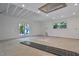 Large unfinished basement with high ceilings and natural light at 510 Wideview Ave, Tarpon Springs, FL 34689