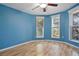 Bright bedroom with light wood floors and bay windows at 510 Wideview Ave, Tarpon Springs, FL 34689