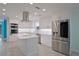 Modern kitchen with white cabinets, stainless steel appliances, and an island at 510 Wideview Ave, Tarpon Springs, FL 34689
