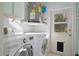 Laundry room with washer, dryer, and exterior access at 510 Wideview Ave, Tarpon Springs, FL 34689