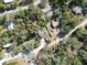 Aerial view of home with surrounding trees at 9834 Miramar St, New Port Richey, FL 34654