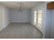 Simple dining room with tiled floor and french doors at 9834 Miramar St, New Port Richey, FL 34654