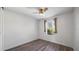 Bedroom featuring wood floors, ceiling fan, and window at 12843 Buffalo Run Dr, Gibsonton, FL 33534