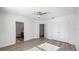 Large bedroom features wood flooring, ceiling fan, a large closet and an ensuite bathroom at 12843 Buffalo Run Dr, Gibsonton, FL 33534