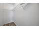 Walk-in closet with wire shelves and wood flooring at 12843 Buffalo Run Dr, Gibsonton, FL 33534
