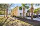 Charming home with a well-maintained lawn and driveway, complemented by mature trees and lush landscaping at 12843 Buffalo Run Dr, Gibsonton, FL 33534