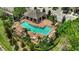 Community pool with plenty of lounge chairs for relaxation at 12843 Buffalo Run Dr, Gibsonton, FL 33534