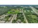 Aerial view of townhouses next to sports fields and a highway at 12843 Buffalo Run Dr, Gibsonton, FL 33534