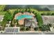 Community pool with lounge chairs and a clubhouse at 12843 Buffalo Run Dr, Gibsonton, FL 33534