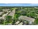 Aerial view of townhouses, with a park and highway in the background at 12843 Buffalo Run Dr, Gibsonton, FL 33534