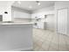 Kitchen with white cabinets and tile flooring at 416 28Th W St, Palmetto, FL 34221