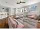 Bright living room with hardwood floors and pink sofas at 416 28Th W St, Palmetto, FL 34221