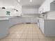 Kitchen with white cabinets and tile flooring at 416 28Th W St, Palmetto, FL 34221