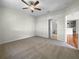 Primary bedroom with ceiling fan and access to bathroom at 416 28Th W St, Palmetto, FL 34221
