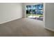Spacious bedroom with carpet and sliding glass doors to patio at 416 28Th W St, Palmetto, FL 34221