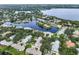 Aerial view of houses near a waterway and lush vegetation at 1092 Sanabel Ne Ct, St Petersburg, FL 33702