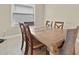 Simple dining room with wood table and four chairs at 16831 Canopy Garden Dr, Port Charlotte, FL 33953