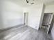 Spacious bedroom with wood-look floors and access to a closet at 1378 Wilmette St, Port Charlotte, FL 33980