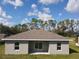 Rear view of newly constructed home with sliding doors at 1378 Wilmette St, Port Charlotte, FL 33980