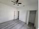 Bedroom with gray floors, ceiling fan and closet at 1378 Wilmette St, Port Charlotte, FL 33980