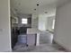 Modern kitchen with island, stainless steel appliances, and gray cabinets at 1378 Wilmette St, Port Charlotte, FL 33980