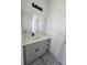 Modern bathroom with gray vanity, quartz countertop, and floating sink at 1378 Wilmette St, Port Charlotte, FL 33980