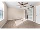 Bright bedroom featuring a ceiling fan and carpet flooring at 1514 Seagull Bay Way, Brandon, FL 33511