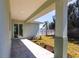 Covered back porch with decorative landscaping and access to the backyard at 5316 Altoona St, Sarasota, FL 34232