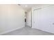 Bright bedroom featuring modern closet doors and light gray tile flooring at 5316 Altoona St, Sarasota, FL 34232